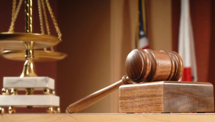 Legal concept still life in a courtroom with American and Californian flags in the background